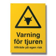 Skilt der advarer om tyr, vigtigt for sikkerheden på gården.